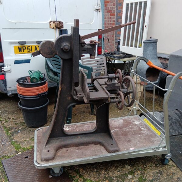 Antique cast iron mortice machine, a vintage woodworking tool.