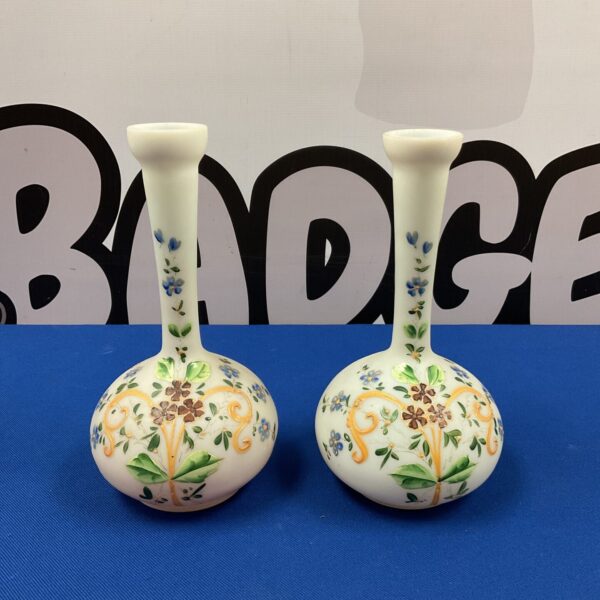 Antique porcelain spill vase with vibrant floral design.