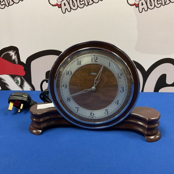Vintage Art Deco Metamec mantle clock with dark wood case.
