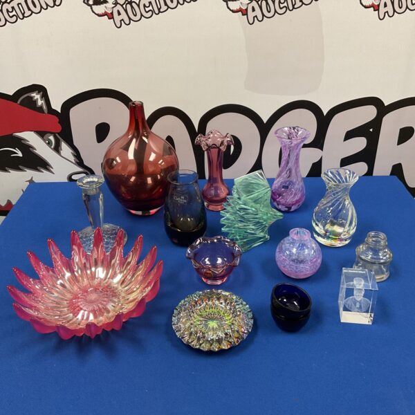 Colourful art glass collection with swirling patterns and vibrant hues.