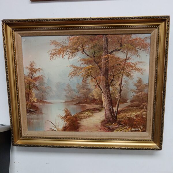 Signed C Inness oil painting of a tranquil autumn river landscape.