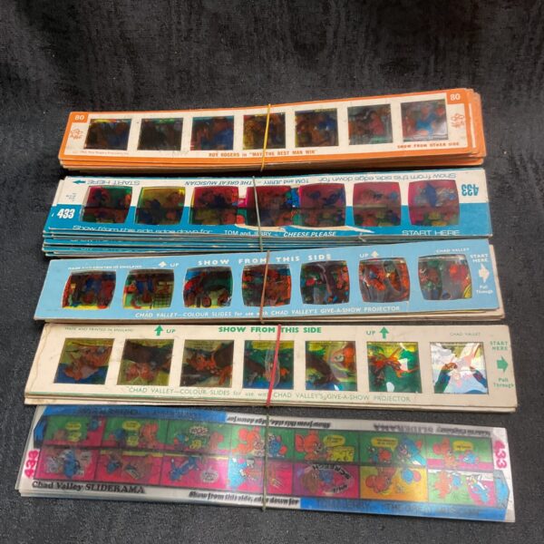 Vintage Chad Valley Colour Sliderama slides lot featuring various characters.