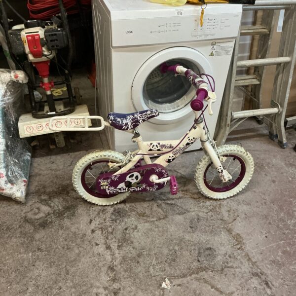 A colourful child’s panda-themed bicycle, perfect for learning to ride.