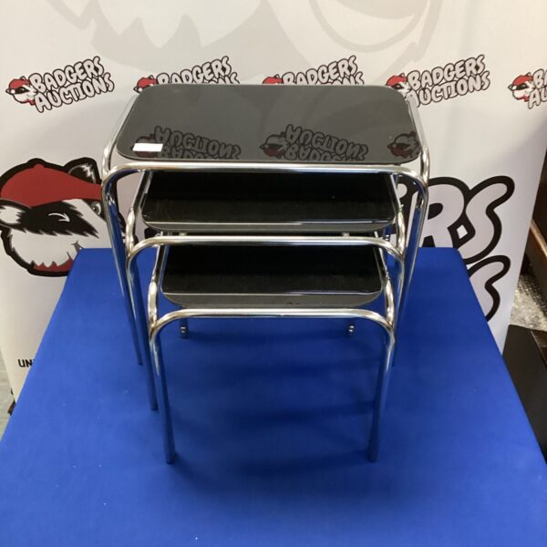 Stylish chrome and black glass nest of tables for retro interiors.