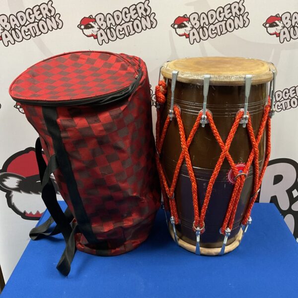 Indian dholak drum with travel case, a traditional percussion instrument.