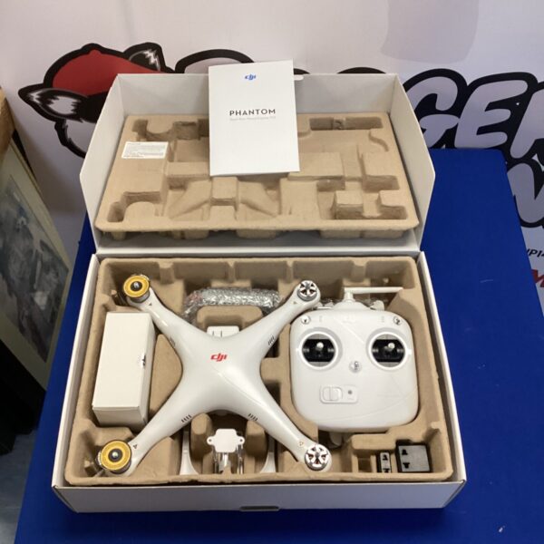 White DJI Phantom drone with remote control in auction.