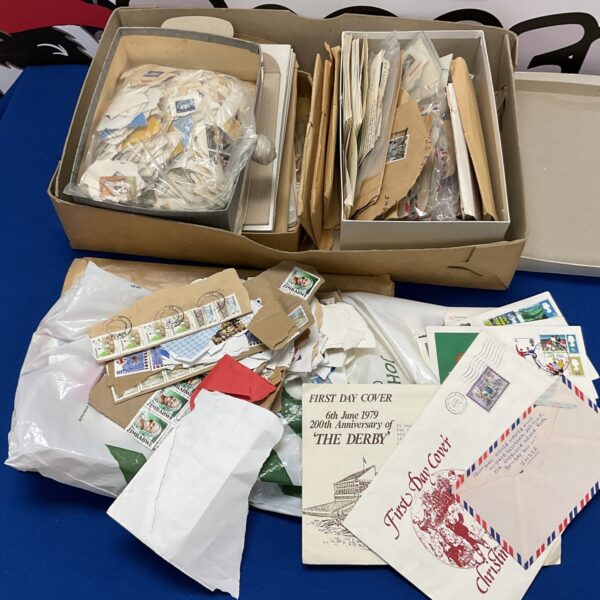 Large lot of vintage first day covers and loose stamps for collectors.