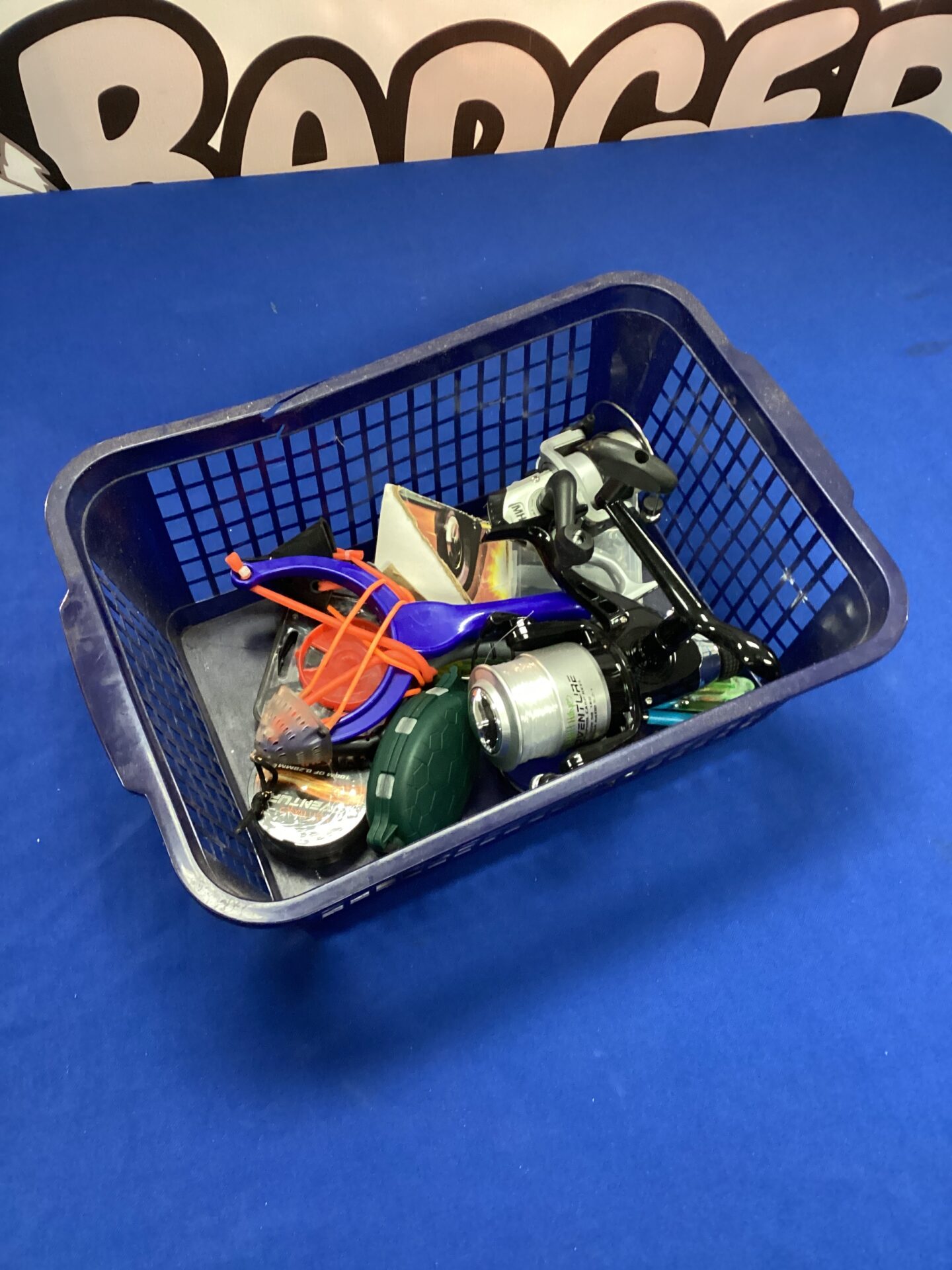 724 Basket of fishing reels & bait shot