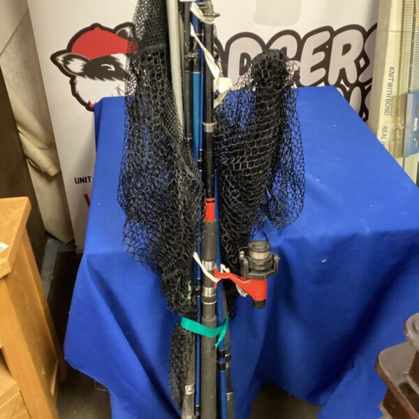 Assorted fishing rods and landing net bundle for sale.