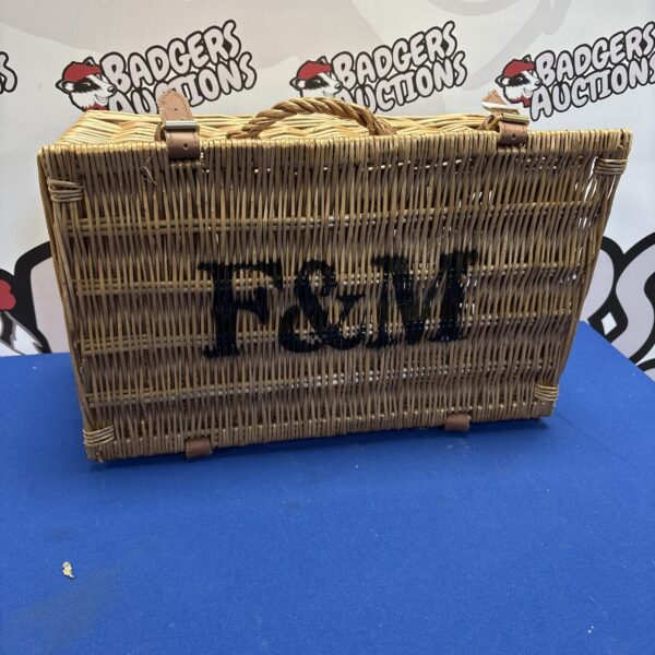 Vintage F&M wicker storage basket with woven detail.
