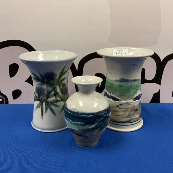 Vintage Highland stoneware vase with vibrant floral design.