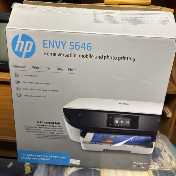 HP Envy 5646 wireless all-in-one printer in a home setting.