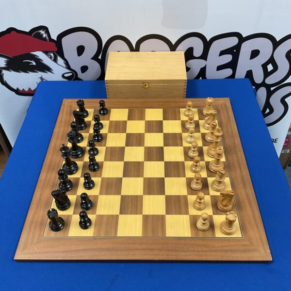 Large wooden chess set with chunky pieces on a checkered board.