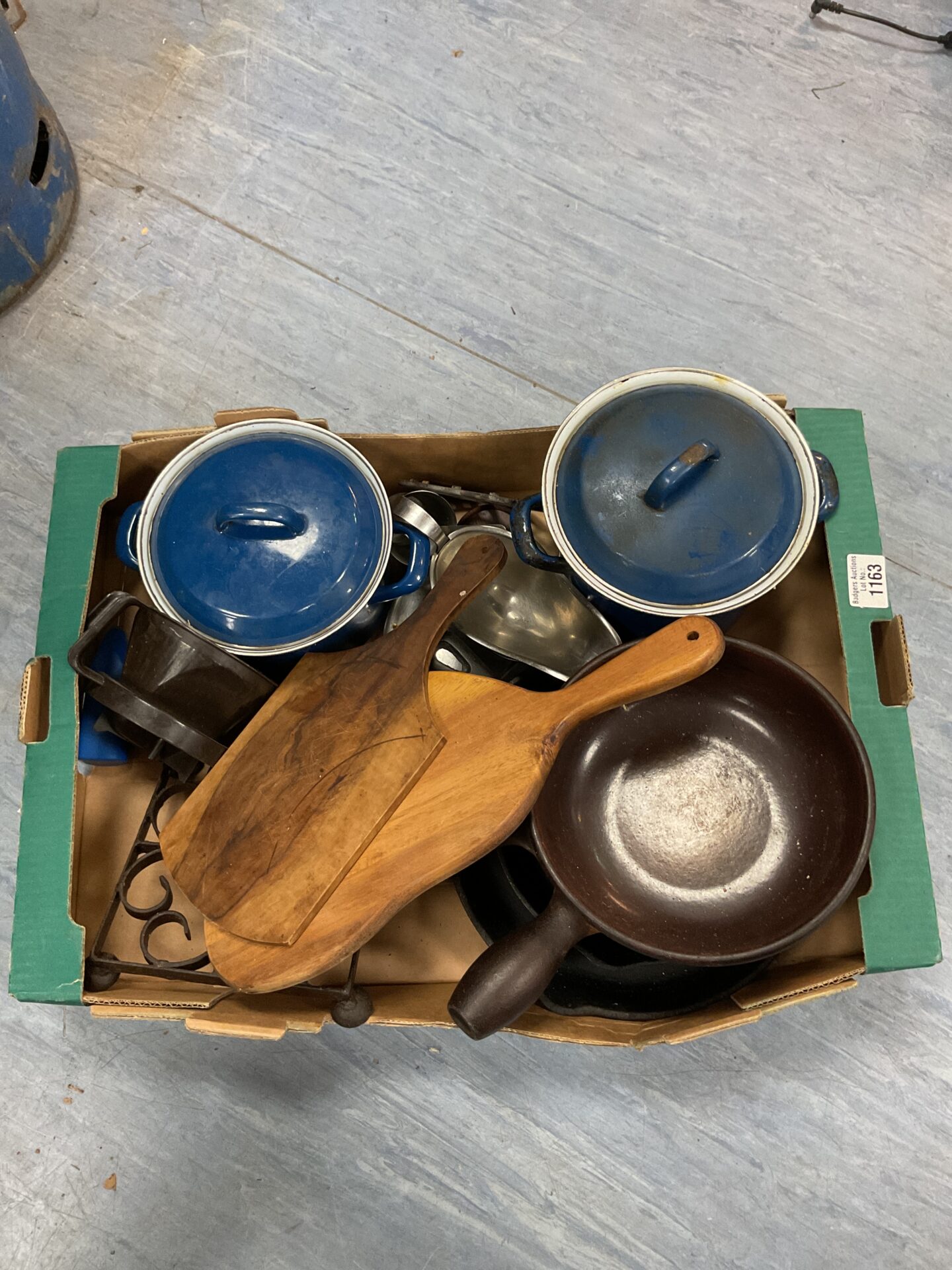1163 Box of vintage kitchenware inc Le creuset cast iron saucepans with blue emerald lids, a cast iron frying pan and wooden cutting boards