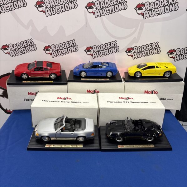 Quantity of boxed Maisto diecast model cars for collectors.