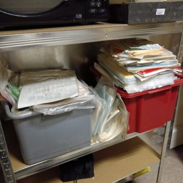 Stack of boxes containing vintage model aircraft transfers.