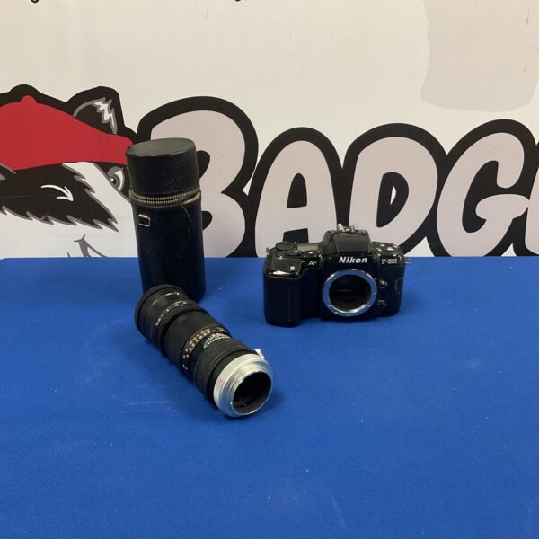 Vintage Nikon F601 camera with Palinar telephoto lens for film photography.