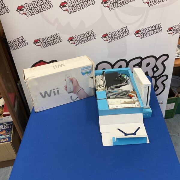Nintendo Wii console in original box with remotes.