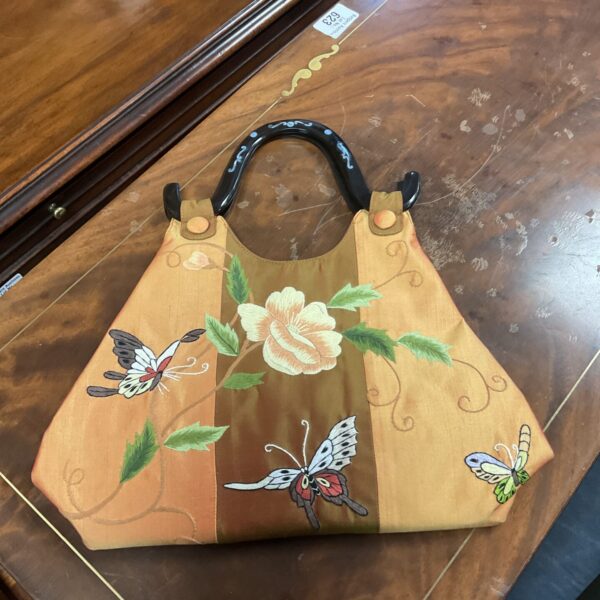 Vintage oriental butterfly handbag with mother of pearl handle.