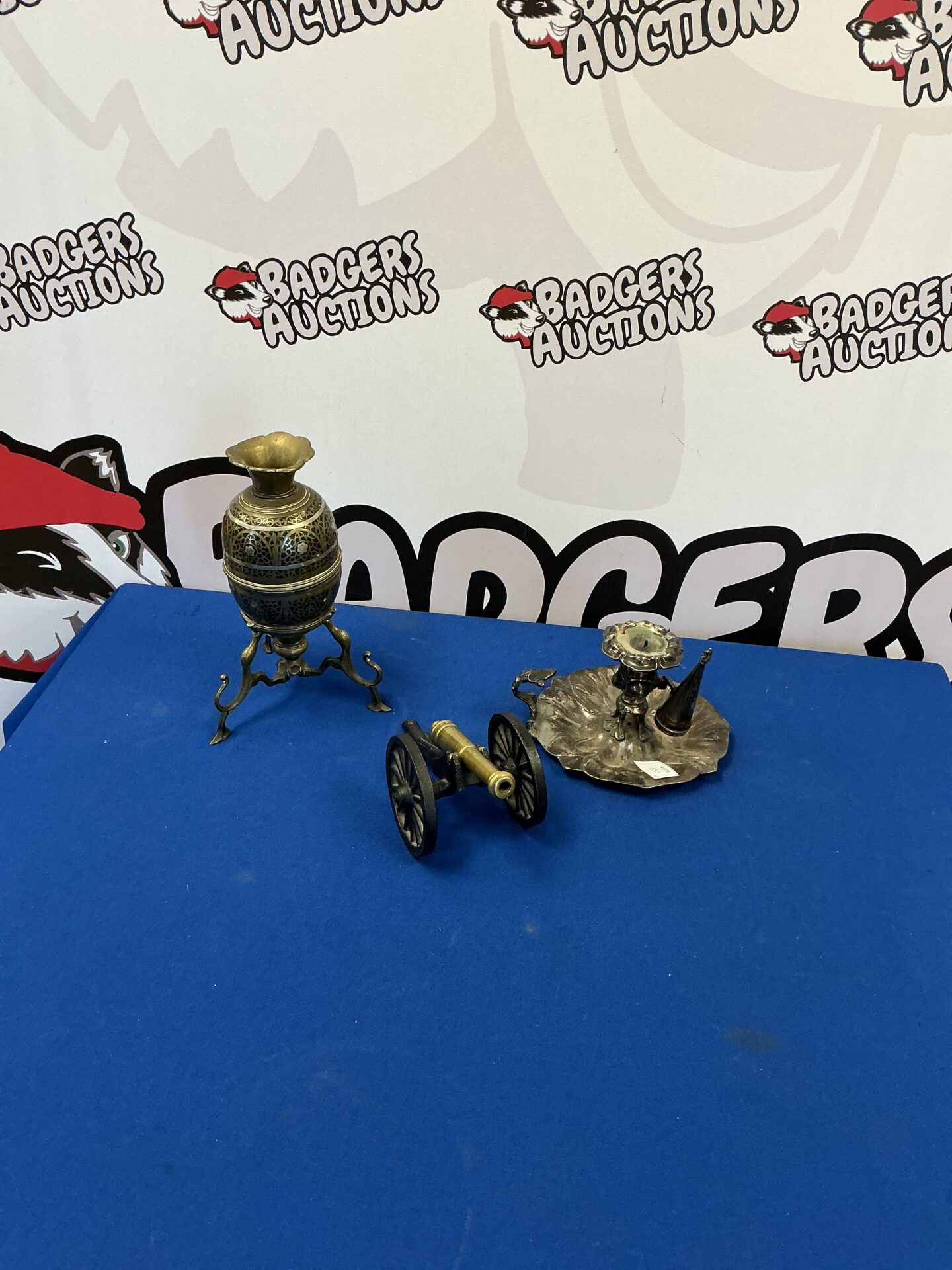 291 Three metal table items inc Candle Holder and cast iron and brass cannon