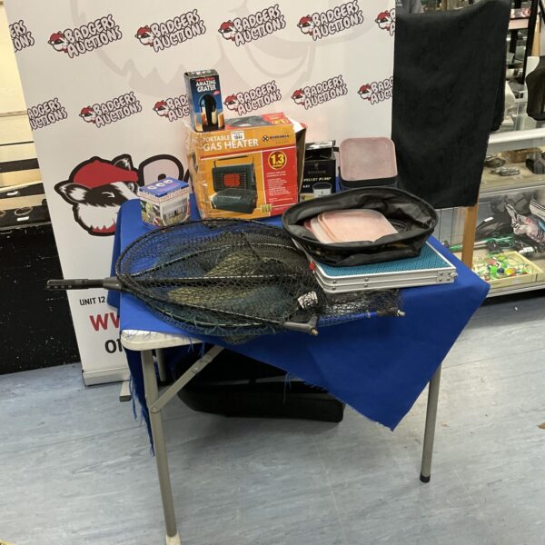 Portable gas heater with fishing accessories for outdoor use.