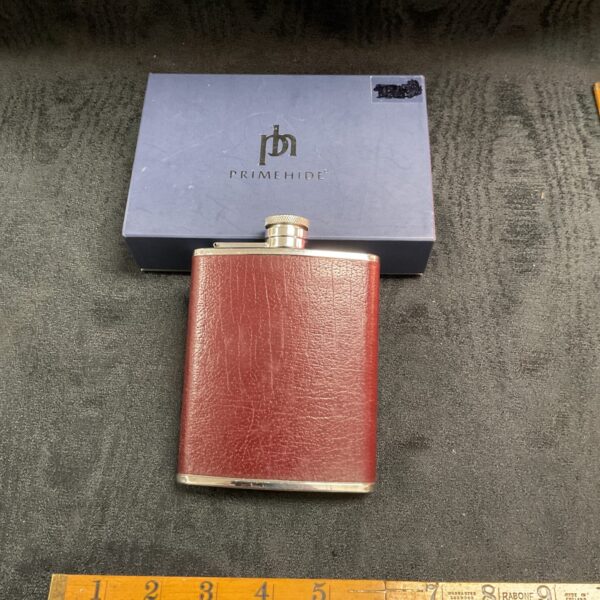 Vintage burgundy Primehide hip flask in original box.