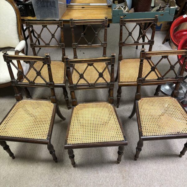 Set of six antique Regency rose cross back chairs with woven seats.