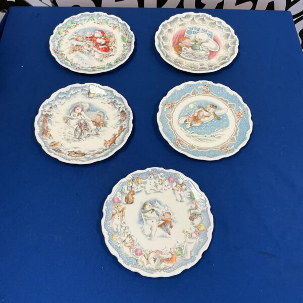 Royal Doulton The Snowman plate with a winter scene.