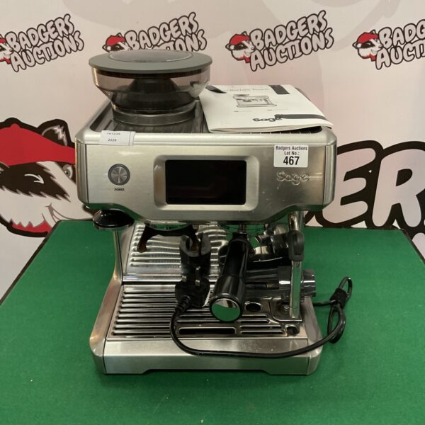 Stainless steel Sage Barista Touch espresso machine with touchscreen display.