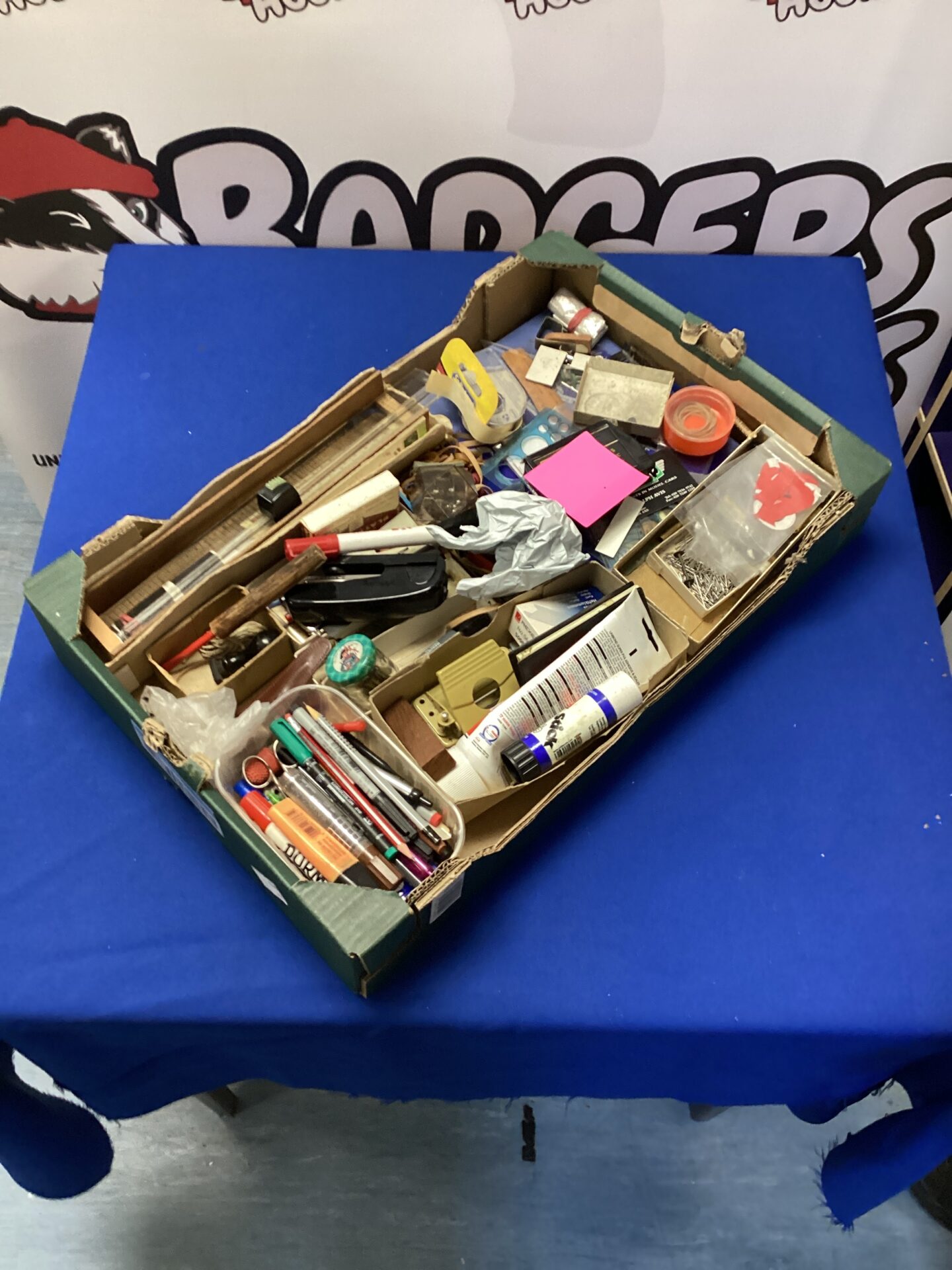 538 Box of mixed stationary items, including rulers, pens and pencils, stapler and digital calculator tape measure