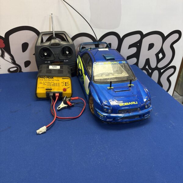 Subaru Impreza RC car with remote control and charger.