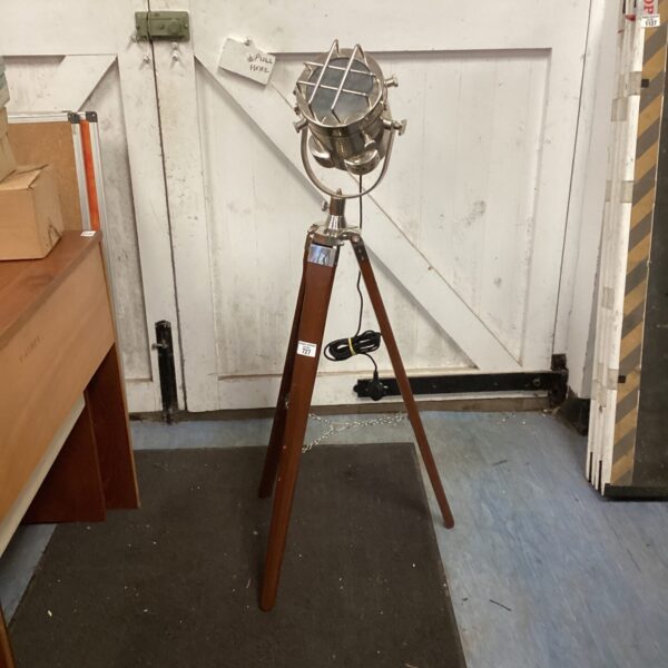 Vintage tripod floor lamp with adjustable spotlight head.