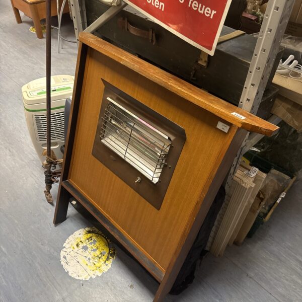 Vintage Belling electric heater with wooden cabinet and metal grill.