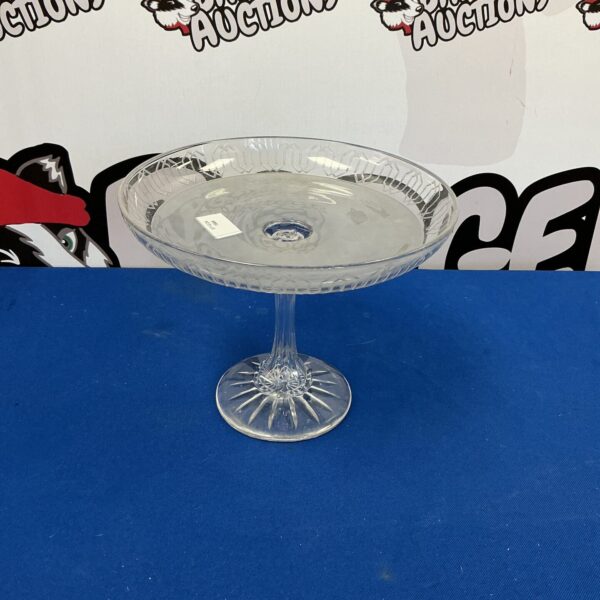 Elegant vintage cut glass cake stand for displaying desserts.