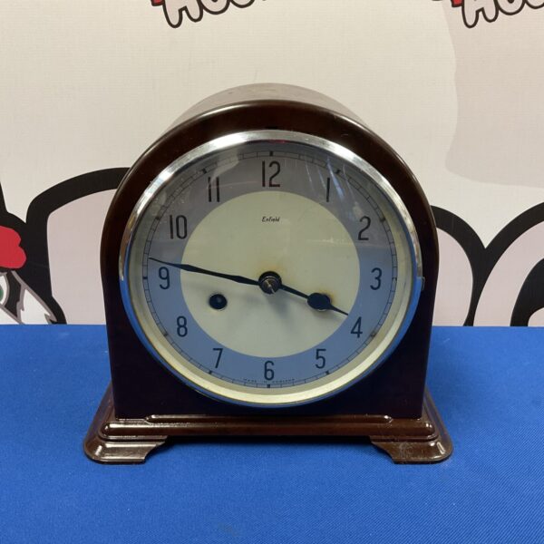 Vintage Enfield mantle clock with black dial and bakelite case.