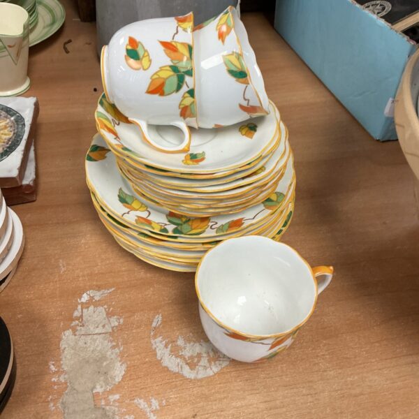 Vintage Foley China tea set with floral design on display.