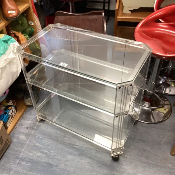 Clear lucite trolley with three tiers, vintage mid century modern style.