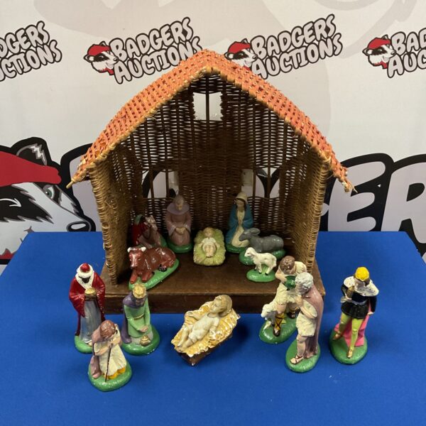 Vintage nativity set with wicker manger and plaster figures.