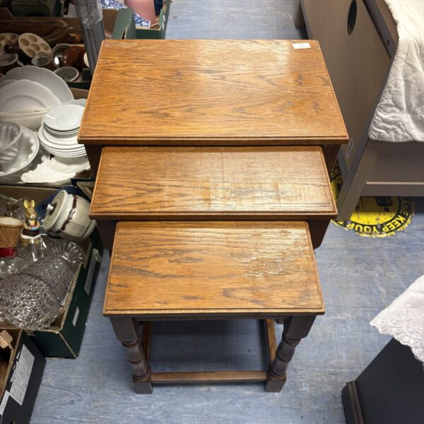 Vintage solid oak nest of tables with turned legs.