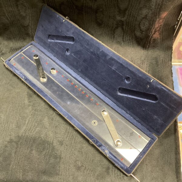 Vintage scala parallel rule drafting tool with scale markings.