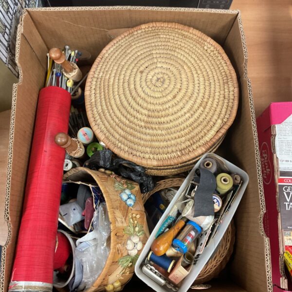 Vintage sewing and craft lot with woven basket and supplies.