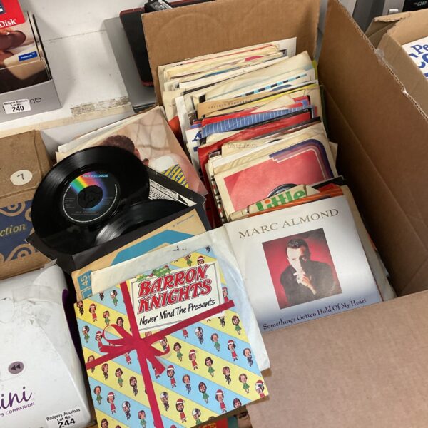 A box of vintage 7 inch vinyl singles for collectors.