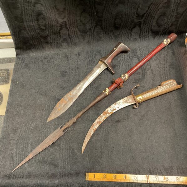 Zulu spear and daggers set, traditional African tribal weapons.
