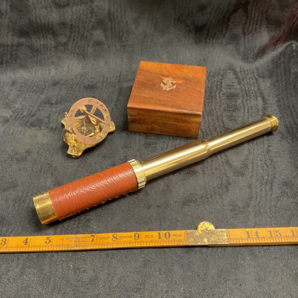 Antique brass telescope with sextant and compass in wooden box.