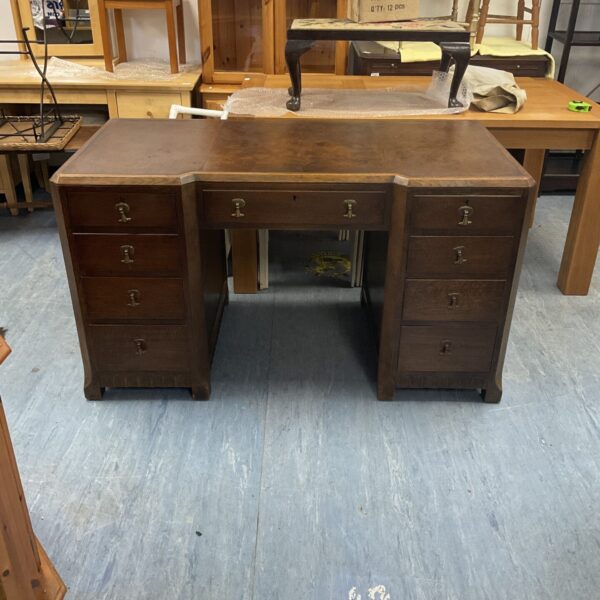 Vintage Art Deco writing desk with leather top and drawers.