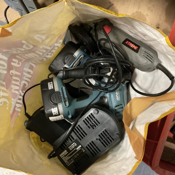 Bauer corded drill within a bag of untested power tools.