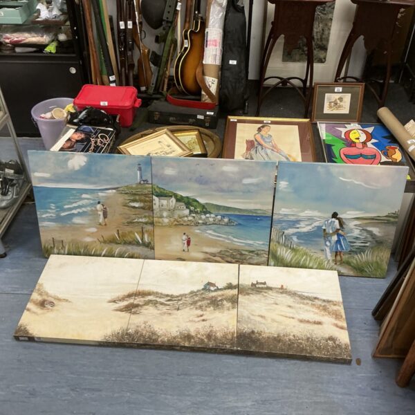 Framed beach scene prints offering coastal wall art.
