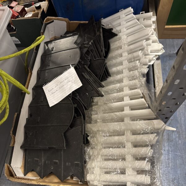 Black plastic lawn edging pieces for garden borders.