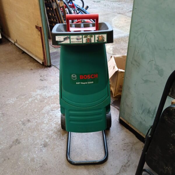 Bosch AXT Rapid 2200 garden chipper in a workshop setting.