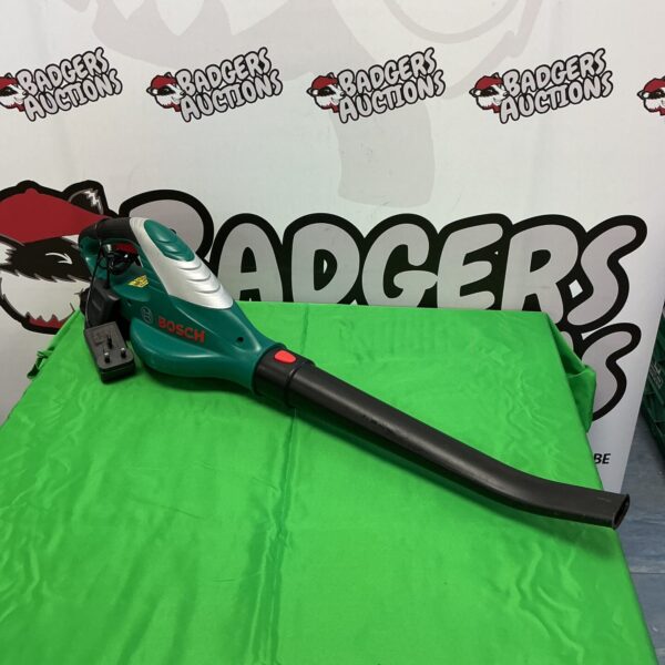 Bosch battery leaf blower with charger for garden cleaning.